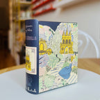 Book style case with colorful cover featuring Cinderella and fairy tale scene on a table
