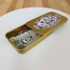Gold tin with Japanese stickers inside