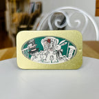 Decorative tin with a design of characters such as rabbit, Alice, and Mad Hatter having a tea party