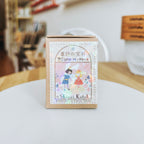 Shinzi Katoh product packaging on a white surface with a blurred background