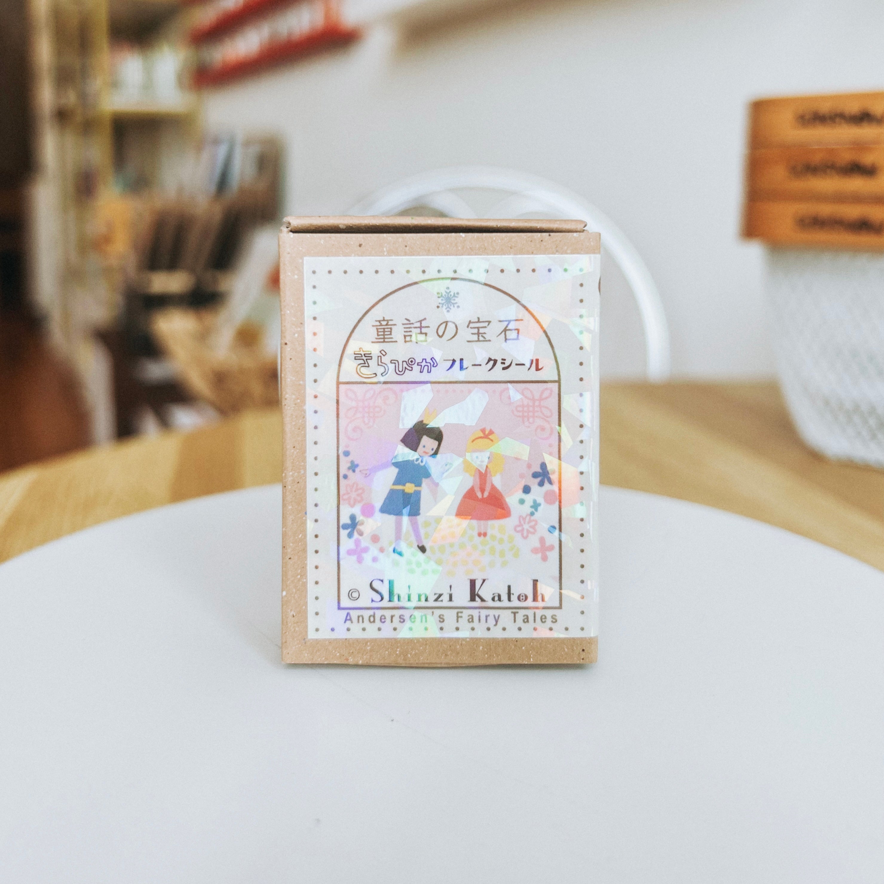 Shinzi Katoh product packaging on a white surface with a blurred background